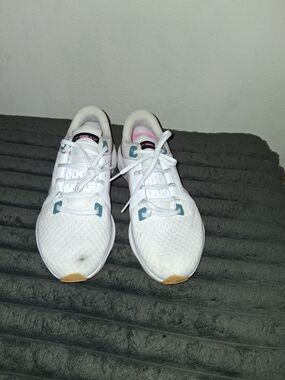 Nike Women's White Running Shoes with Teal and Pink Accents